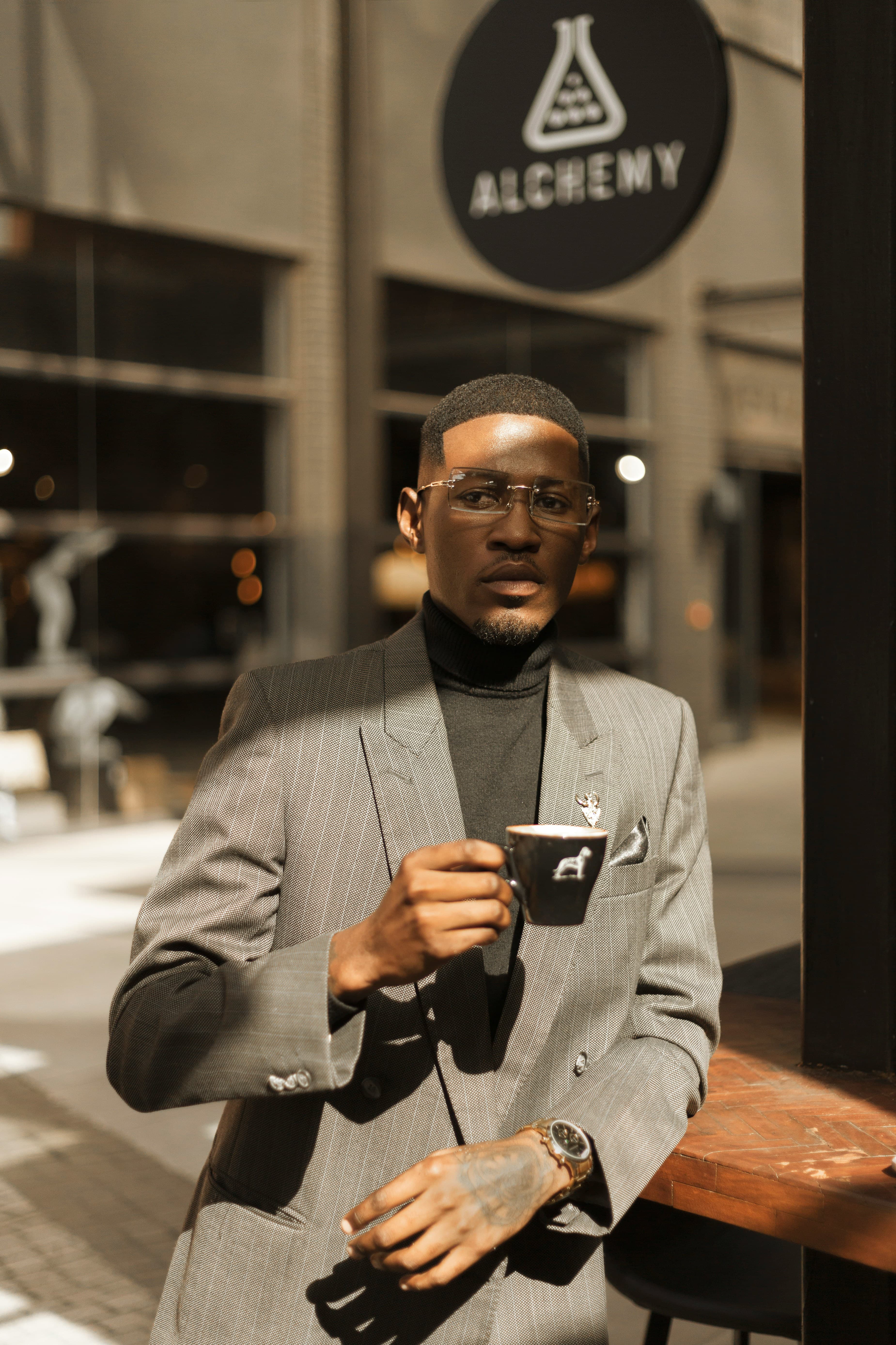 Man in suit holding coffee